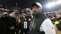Pittsburgh Steelers head coach Mike Tomlin and quarterback Aaron Rodgers (8) celebrate after defeating the Baltimore Ravens at Acrisure Stadium.