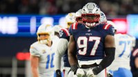 New England Patriots defensive end Milton Williams (97) celebrates a sack during the second quarter against the Los Angeles Chargers in an AFC Wild Card Round game at Gillette Stadium.