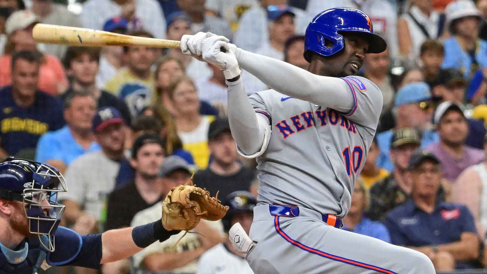 Aug 10, 2025; Milwaukee, Wisconsin, USA; New York Mets third baseman Ronny Mauricio (10) drives in a run with a base hit in the third inning against the Milwaukee Brewers at American Family Field. Mandatory Credit: Benny Sieu-Imagn Images