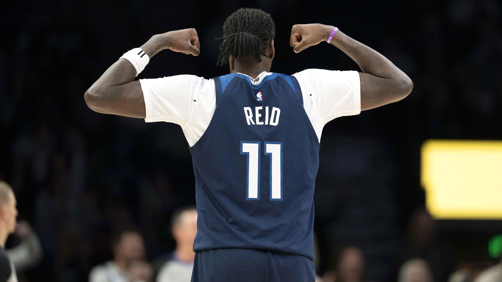 Minnesota Timberwolves center Naz Reid (11) flexes his arms after a shot