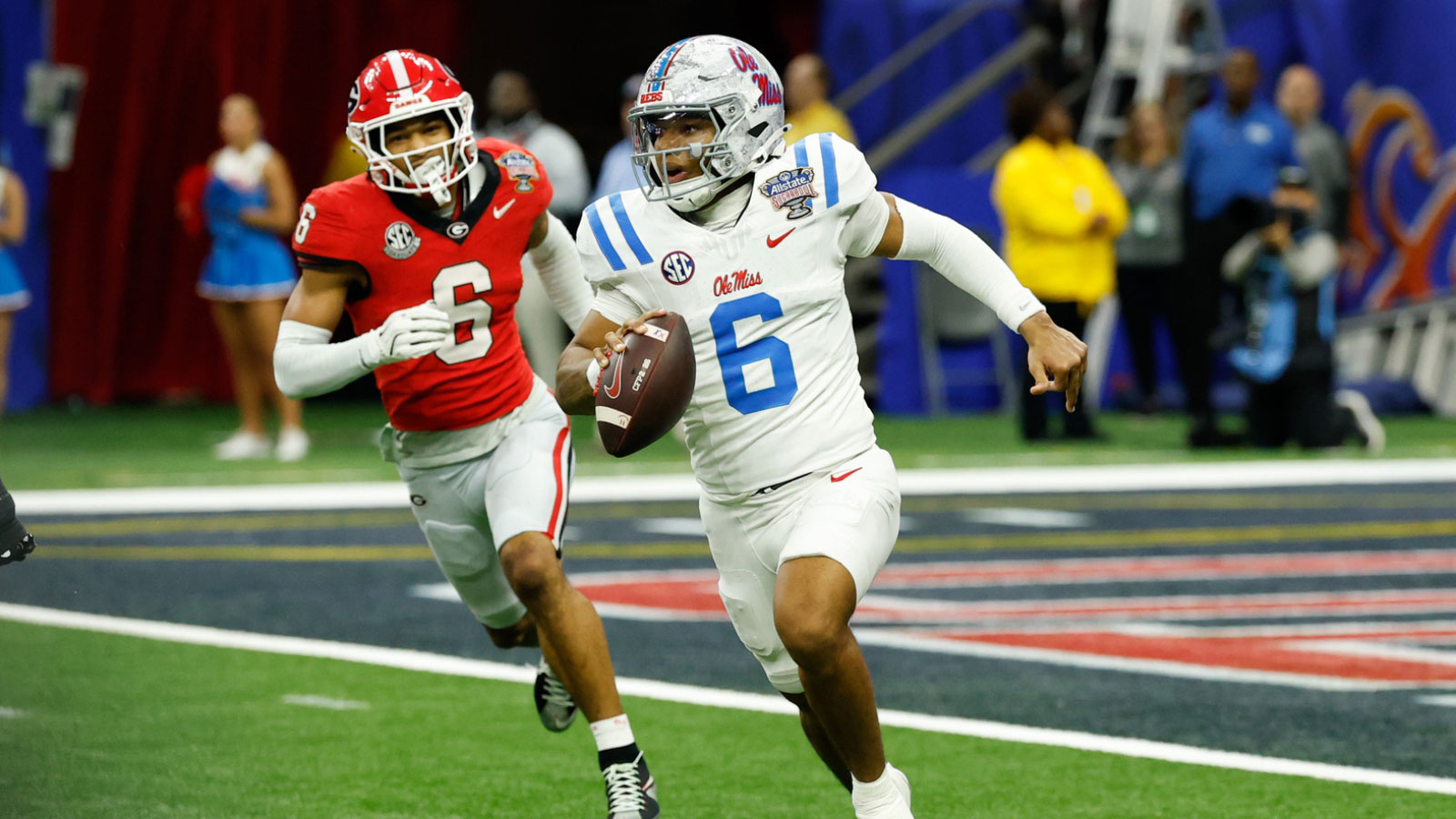 Mississippi Rebels quarterback Trinidad Chambliss (6) scrambles with the ball under pressure from Georgia Bulldogs defensive back Daylen Everette (6) in the fourth quarter during the 2025 Sugar Bowl and quarterfinal game of the College Football Playoff at Caesars Superdome. 