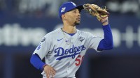 Los Angeles Dodgers shortstop Mookie Betts (50) makes a catch against Toronto Blue Jays center fielder Daulton Varsho (5) in the second inning during game six of the 2025 MLB World Series at Rogers Centre.