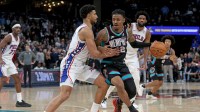 Memphis Grizzlies guard Ja Morant (12) drives to the basket as Philadelphia 76ers guard Quentin Grimes (5) defends during the fourth quarter at FedExForum