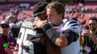 Cleveland Browns defensive end Myles Garrett (95) and Cincinnati Bengals quarterback Joe Burrow (9) hug after the fourth quarter of the NFL Week 1 game between the Cleveland Browns and the Cincinnati Bengals at Huntington Bank Field in Cleveland on Sunday, Sept. 7, 2025. The Bengals begin the season with a 17-16 win over the Browns.