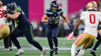 Seattle Seahawks running back Zach Charbonnet (26) carries the ball against the San Francisco 49ers during the first half in an NFC Divisional Round game at Lumen Field. Mandatory Credit: Steven Bisig-Imagn Images