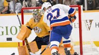 Nashville Predators goaltender Juuse Saros (74) blocks the shot of New York Islanders left wing Anders Lee (27) during the second period at Bridgestone Arena. Mandatory Credit: Steve Roberts-Imagn Images