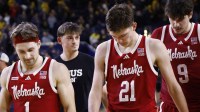 Nebraska Cornhuskers guard Sam Hoiberg (1) Nebraska Cornhuskers forward Pryce Sandfort (21) and Nebraska Cornhuskers forward Berke Buyuktuncel (9) walk off after the game against the Michigan Wolverines at Crisler Center.