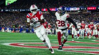 New England Patriots wide receiver Kayshon Boutte (9) catches a pass for a touchdown against New York Giants cornerback Cor'Dale Flott (28) during the first quarter at Gillette Stadium.