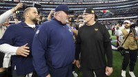 Dallas Cowboys head coach Mike McCarthy (left) speaks with Washington Commanders head coach Dan Quinn after the game at AT&T Stadium.