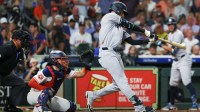 New York Yankees right fielder Cody Bellinger (35) hits a single against the Houston Astros in the fifth inning at Daikin Park.