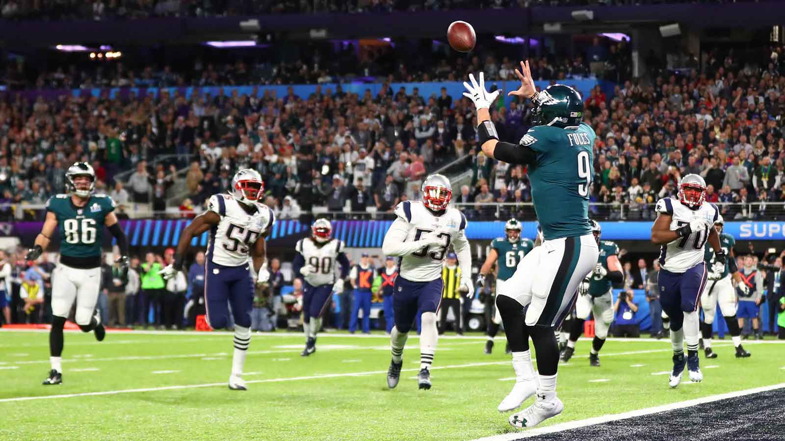 Philadelphia Eagles quarterback Nick Foles (9) catches a touchdown pass against the New England Patriots in the second quarter in Super Bowl LII at U.S. Bank Stadium. 