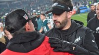 Philadelphia Eagles head coach Nick Sirianni and San Francisco 49ers head coach Kyle Shanahan meet on the field after the game at Lincoln Financial Field.