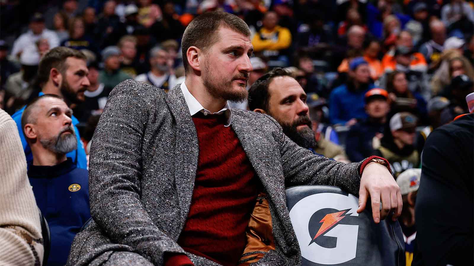 Denver Nuggets center Nikola Jokic (15) looks on from the bench in the third quarter against the Washington Wizards at Ball Arena.