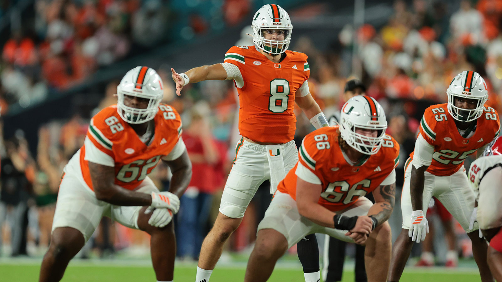 Miami Hurricanes quarterback Emory Williams (8) signals from behind the line of scrimmage against NC State Wolfpack during the fourth quarter at Hard Rock Stadium.