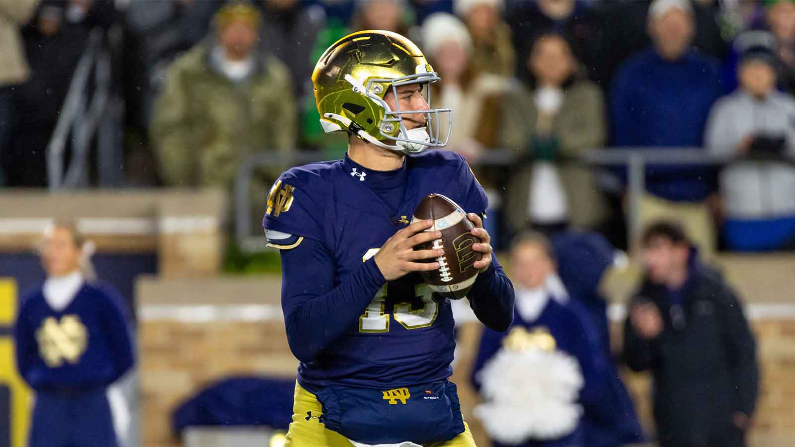 Notre Dame Fighting Irish quarterback CJ Carr (13) looks to pass against the Navy Midshipmen during the first half at Notre Dame Stadium.