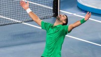 Novak Djokovic of Serbia celebrates his victory over Jannik Sinner of Italy in the semifinals of the menís singles at the Australian Open at Rod Laver Arena in Melbourne Park