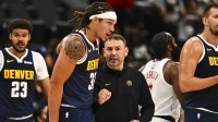 Nuggets Head Coach David Adelman talks with Denver Nuggets forward Aaron Gordon (32) against the Los Angeles Clippers during the second quarter at Intuit Dome