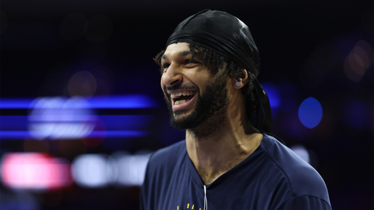 Nuggets guard Jamal Murray before a game against the Philadelphia 76ers at Xfinity Mobile Arena with the Hawks logo in the background
