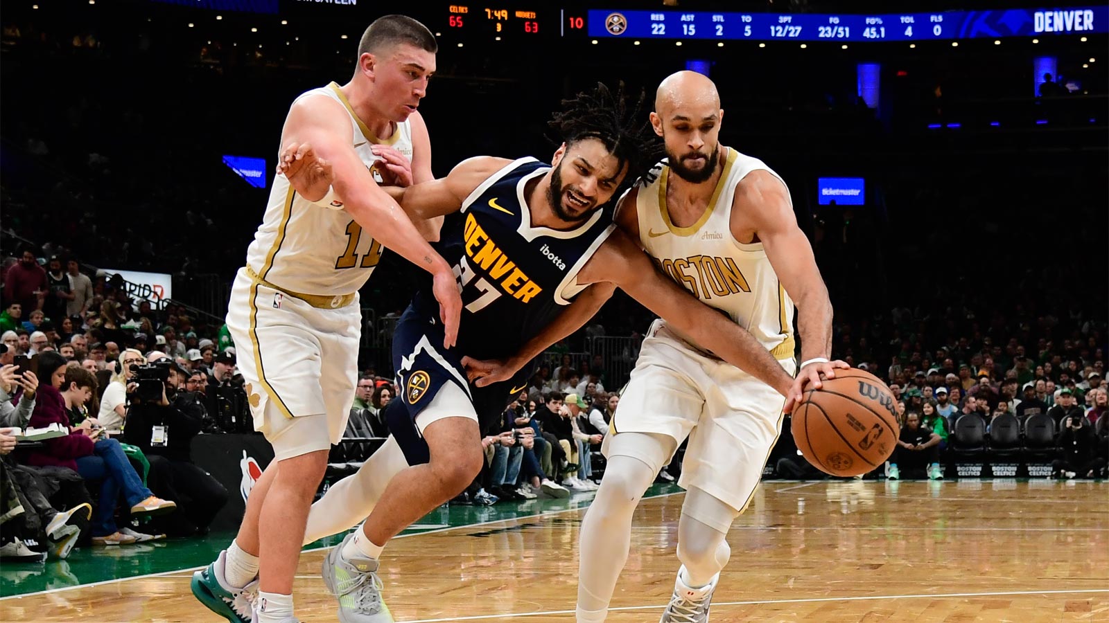 Celtics guard Payton Pritchard (11) fouls Denver Nuggets guard Jamal Murray (27) during the second half at TD Garden