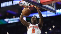 New York Knicks forward Og Anunoby (8) dunks the ball against the Philadelphia 76ers during the second quarter at Xfinity Mobile Arena.
