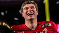 Indiana's Fernando Mendoza (15) smiles on the podium after the College Football Playoff National Championship college football game at Hard Rock Stadium in Miami Gardens on Monday, Jan. 19, 2026.