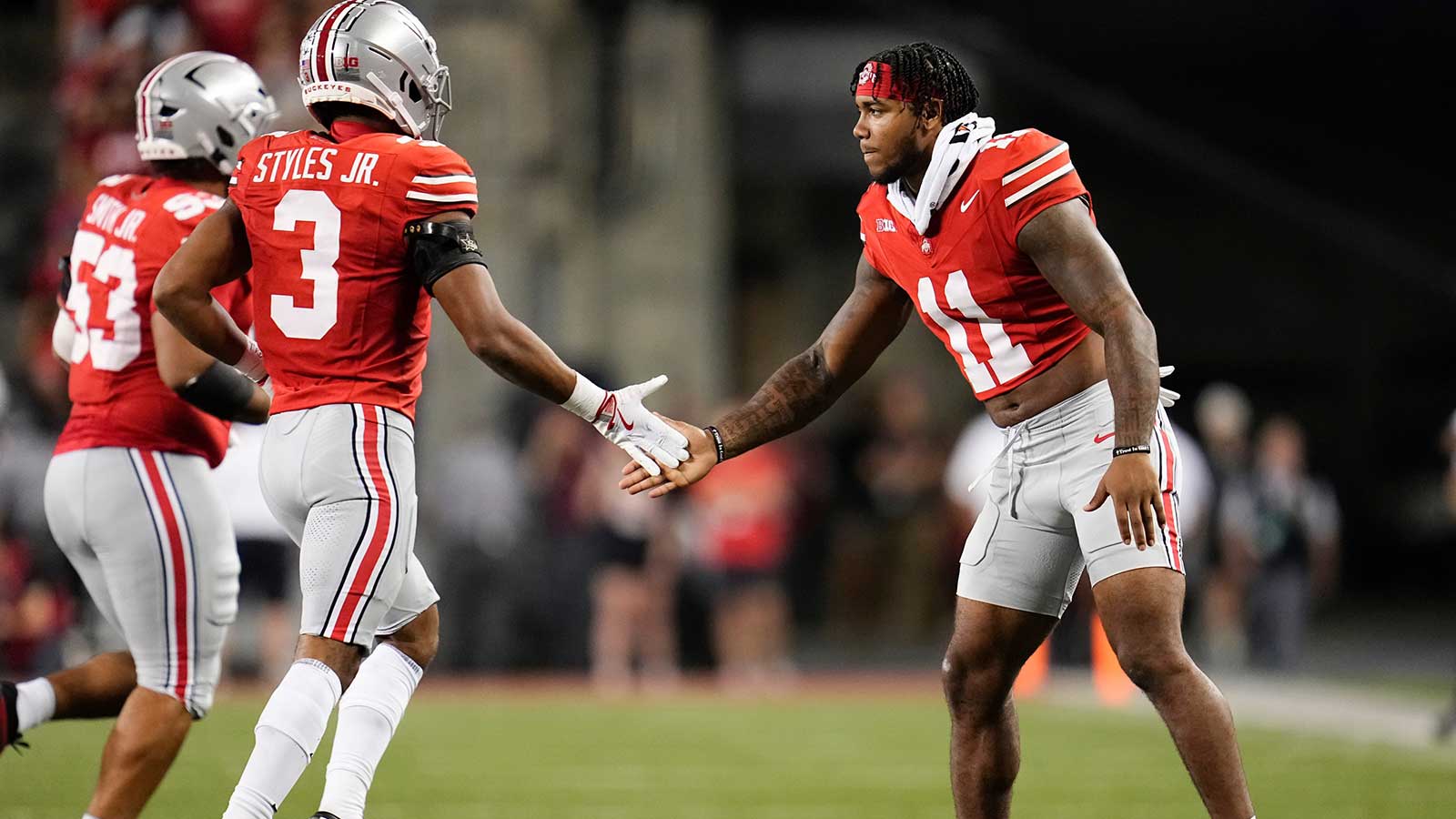 Ohio State Buckeyes linebacker C.J. Hicks (11) high fives cornerback Lorenzo Styles Jr. (3) during the first half of the NCAA football game against the Minnesota Golden Gophers at Ohio Stadium in Columbus on Oct. 4, 2025.