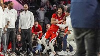 Mississippi Rebels guard Patton Pinkins (23) reacts with staff members after Mississippi defeated the Georgia Bulldogs in overtime at Stegeman Coliseum.