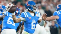Mississippi Rebels quarterback Trinidad Chambliss (6) drops back to pass against the Miami Hurricanes in the first half during the 2026 Fiesta Bowl and semifinal game of the College Football Playoff at State Farm Stadium.