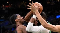 Atlanta Hawks forward Onyeka Okongwu (17) reacts after being hit in the jaw with an elbow by Boston Celtics guard Jaylen Brown (7) during the second half at the TD Garden.