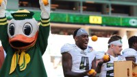 Oregon Ducks wide receiver Malik Benson (4) juggles oranges as the “The Duck” celebrates following the 2025 Orange Bowl and quarterfinal game of the College Football Playoff against the Texas Tech Red Raiders at Hard Rock Stadium.