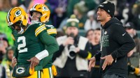 Green Bay Packers quarterback Malik Willis (2) and Green Bay Packers quarterback Jordan Love (10) do a handshake during warmups prior to the game against the Baltimore Ravens at Lambeau Field.