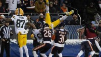 Green Bay Packers wide receiver Christian Watson (9) loses the ball as he dives for the end zone against the Chicago Bears during the first half of an NFC Wild Card Round game at Soldier Field.