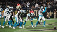 Carolina Panthers running back Rico Dowdle (5) and teammates celebrate at the end zone after scoring a touchdown against the New Orleans Saints during the first quarter at Caesars Superdome