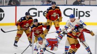 New York Rangers center Jonny Brodzinski (22) goes after the puck against the Florida Panthers during the third period in the 2026 Winter Classic ice hockey game at loanDepot Park.