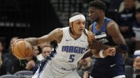 Orlando Magic forward Paolo Banchero (5) works around Minnesota Timberwolves guard Anthony Edwards (5) in the first quarter at Target Center.