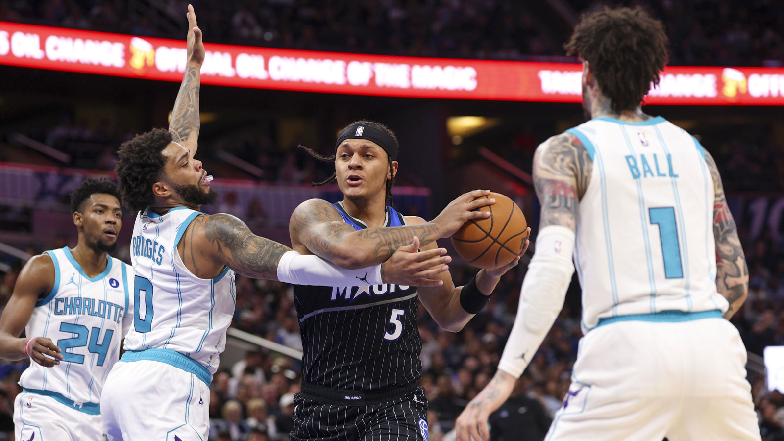 Orlando Magic forward Paolo Banchero (5) drives to the basket past Charlotte Hornets forward Myles Bridges (0) in the second quarter at the Kia Center.