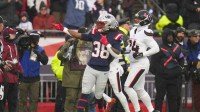 New England Patriots running back Rhamondre Stevenson (38) reacts in the first quarter in an AFC Divisional Round game against the Houston Texans at Gillette Stadium.