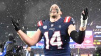 New England Patriots linebacker Robert Spillane (14) reacts after defeating the Houston Texans in an AFC Divisional Round game at Gillette Stadium.