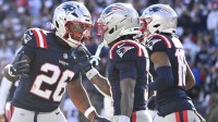 New England Patriots running back Terrell Jennings (26) celebrates his touchdown against the Atlanta Falcons during the first half at Gillette Stadium.
