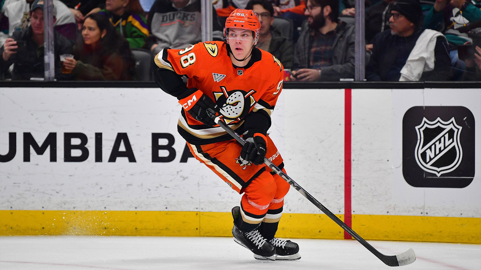 Anaheim Ducks defenseman Pavel Mintyukov (98) moves the puck against the Tampa Bay Lightning during the first period at Honda Center.