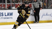Boston Bruins center Pavel Zacha (18) carries the puck against the New Jersey Devils during the third period at TD Garden.