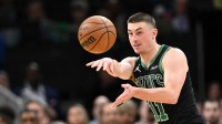 Boston Celtics guard Payton Pritchard (11) passes the ball against the San Antonio Spurs during the first half at the TD Garden.