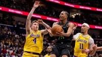 Pelicans forward Trey Murphy III (25) drives to the basket against Los Angeles Lakers forward Dalton Knecht (4) during the second half at Smoothie King Center with the Wizards logo in the background