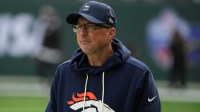 Denver Broncos senior offensive assistant coach Pete Carmichael watches during an NFL International Series game against the New York Jets at Tottenham Hotspur Stadium.