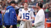 Indianapolis Colts quarterback Philip Rivers (17) with quarterback Riley Leonard (15) on the sidelines during the second half against the Houston Texans at NRG Stadium.