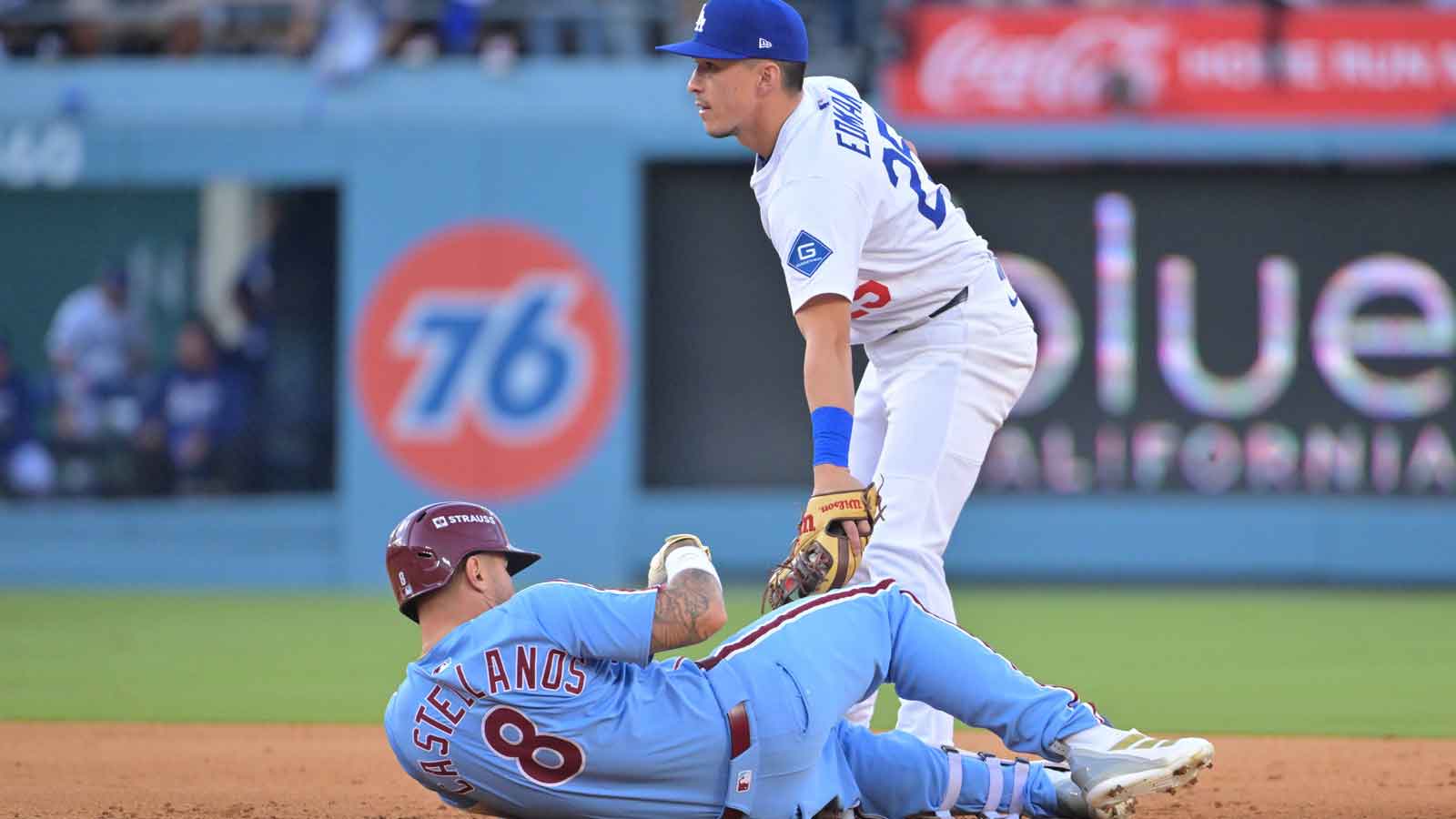 Philadelphia Phillies right fielder Nick Castellanos (8) slides safely into second with a double against Los Angeles Dodgers second baseman Tommy Edman (25) in the seventh inning during game four of the NLDS round for the 2025 MLB playoffs at Dodger Stadium.