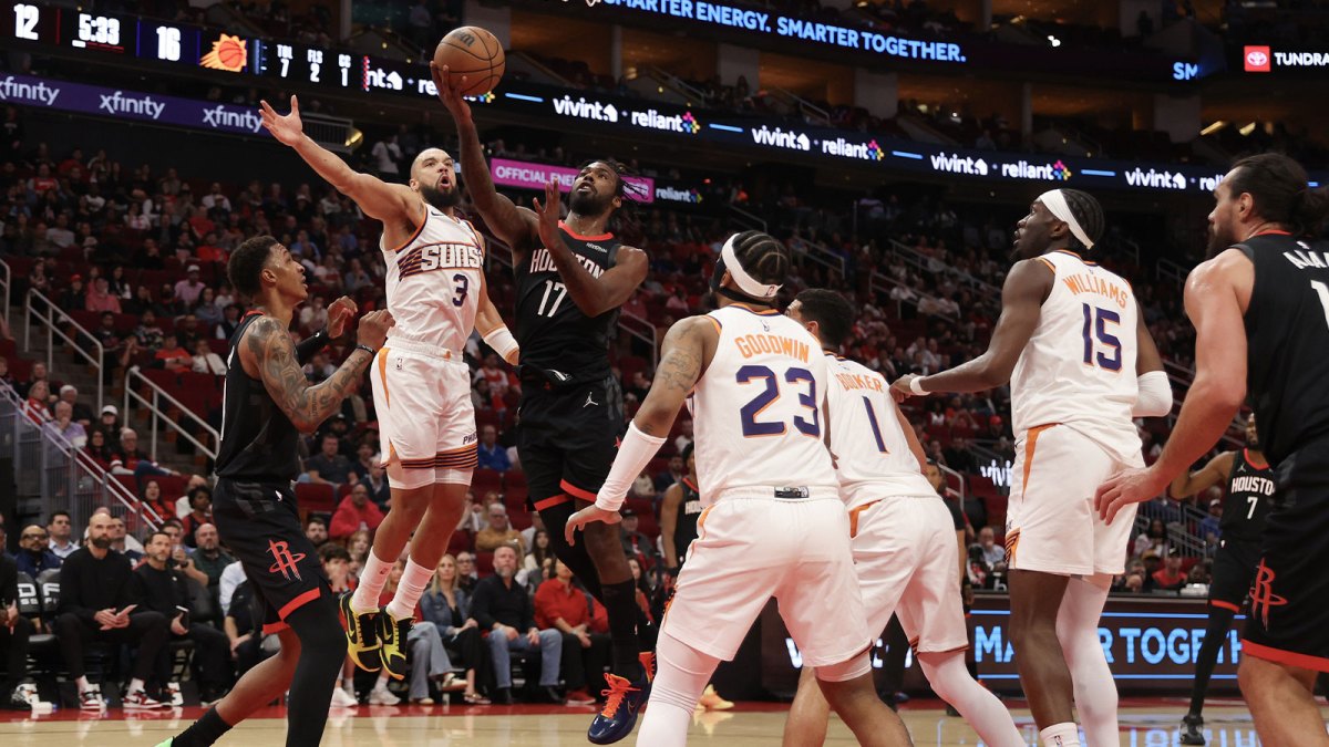 Houston Rockets forward Tari Eason (17) drives to the net against Phoenix Suns forward Dillon Brooks (3) in the first quarter at Toyota Center.