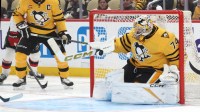 Pittsburgh Penguins goaltender Stuart Skinner (74) makes a save against the New Jersey Devils during the second period at PPG Paints Arena. Mandatory Credit: Charles LeClaire-Imagn Images