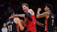 Miami Heat forward Jaime Jaquez Jr. (11) grabs a rebound against Toronto Raptors center Jakob Poeltl (19) during the second quarter at Kaseya Center.