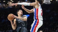 Brooklyn Nets forward Michael Porter Jr. (17) and Detroit Pistons guard Cade Cunningham (2) at Barclays Center.